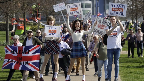 Pro-Brexit leave the European Union supporters pose for photos as they take part in the final leg of the &quot;March to Leave&quot; in London, Friday, March 29, 2019. The protest march which started o ...