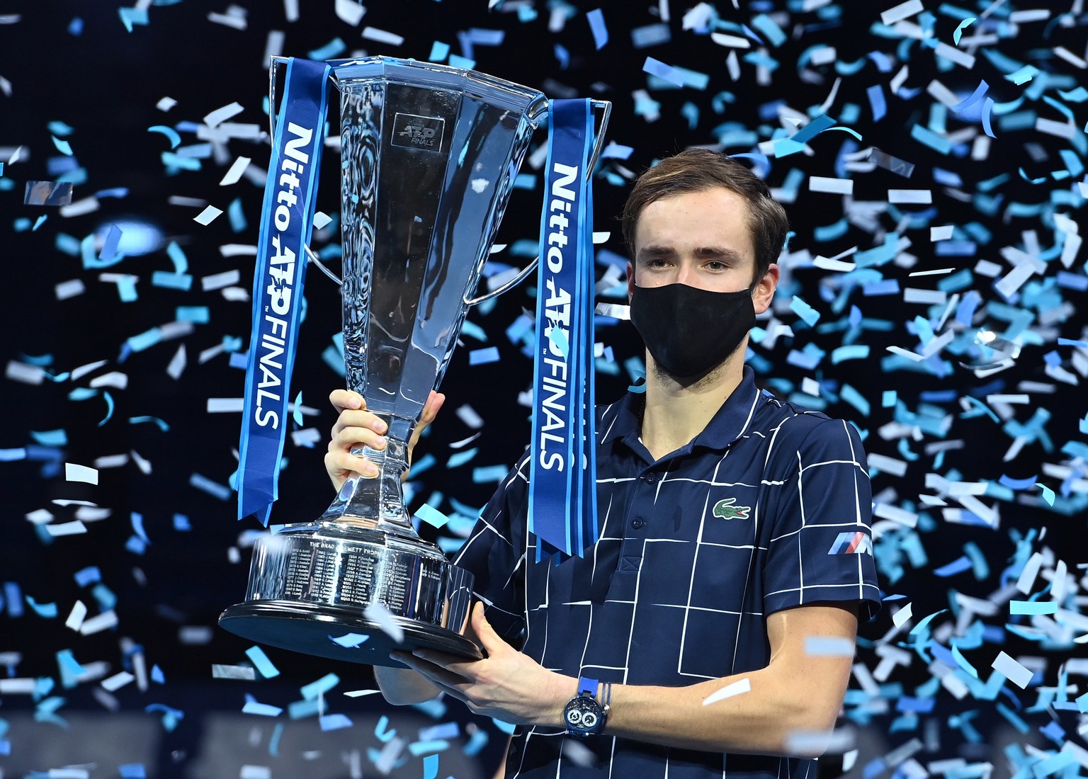 epaselect epa08836628 Daniil Medvedev of Russia celebrates with his trophy after winning against Dominic Thiem of Austria their final match at the ATP World Tour Finals tennis tournament in London, Br ...