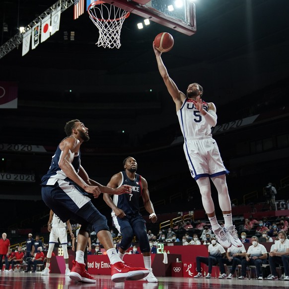 United States&#039; Zachary Lavine (5) shoots over France&#039;s Rudy Gobert (27) during men&#039;s basketball gold medal game at the 2020 Summer Olympics, Saturday, Aug. 7, 2021, in Saitama, Japan. ( ...