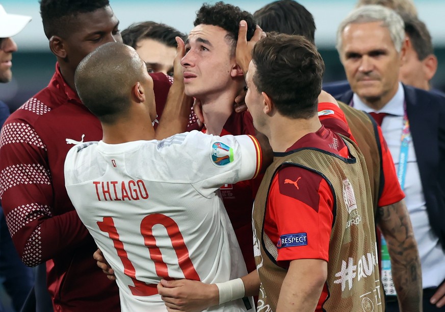 epa09318802 SPanish Thiago Alcantara (L) comforts Ruben Vargas (R) after Switzerland losing the UEFA EURO 2020 quarter final match between Switzerland and Spain in St.Petersburg, Russia, 02 July 2021. ...