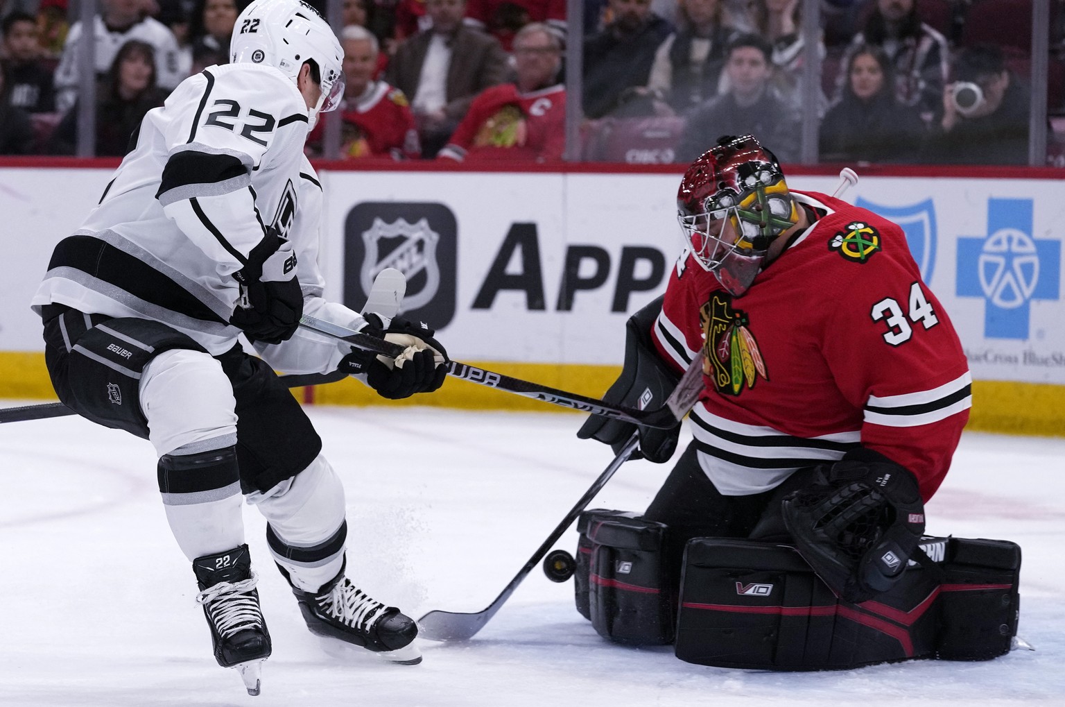 Chicago Blackhawks goaltender Petr Mrazek, right, saves a shot by Los Angeles Kings left wing Kevin Fiala during the first period of an NHL hockey game in Chicago, Sunday, Jan. 22, 2023. (AP Photo/Nam ...