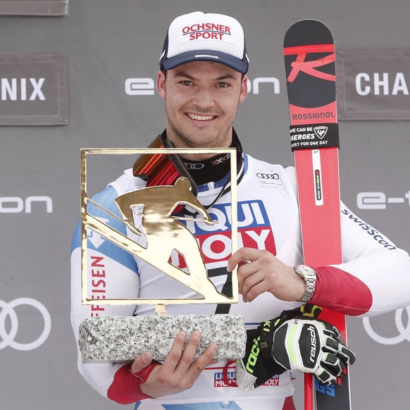 epa08205640 Loic Meillard of Switzerland celebrates on the podium after winning the Men&#039;s Parallel Giant Slalom race at the FIS Alpine Skiing World Cup in Les Houches - Chamonix, France, 09 Febru ...