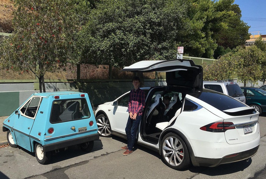 A Citicar by the side of a modern all-electric Tesla Model X (right). Accounting all variants, the Citicar had the record for most production of electric cars from an American manufacturer since 1945  ...