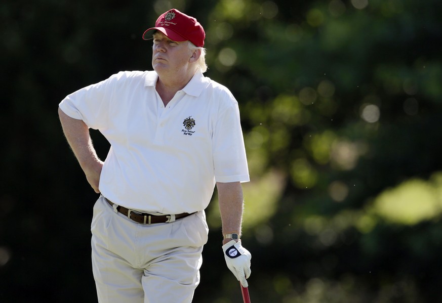 FILE - In this June 27, 2012, file photo, Donald Trump stands on the 14th fairway during a pro-am round of the AT&amp;T National golf tournament at Congressional Country Club in Bethesda, Md. Donald T ...
