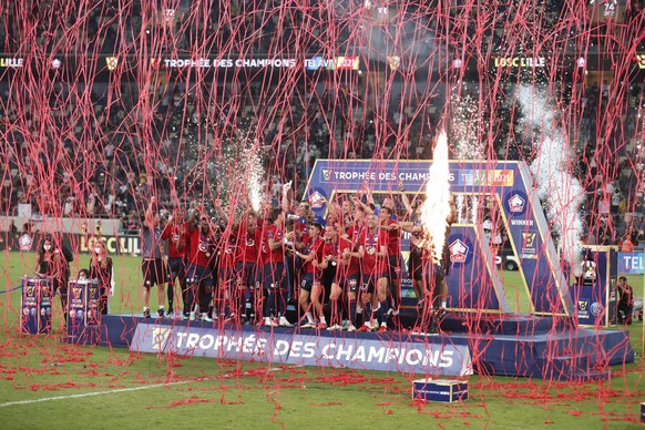 epa09386343 Lille players on the podium celebrate winning the French Supercup Trophee des Champions soccer match between Lille OSC and Paris Saint-Germain (PSG) at the Bloomfield Stadium in Tel Aviv,  ...