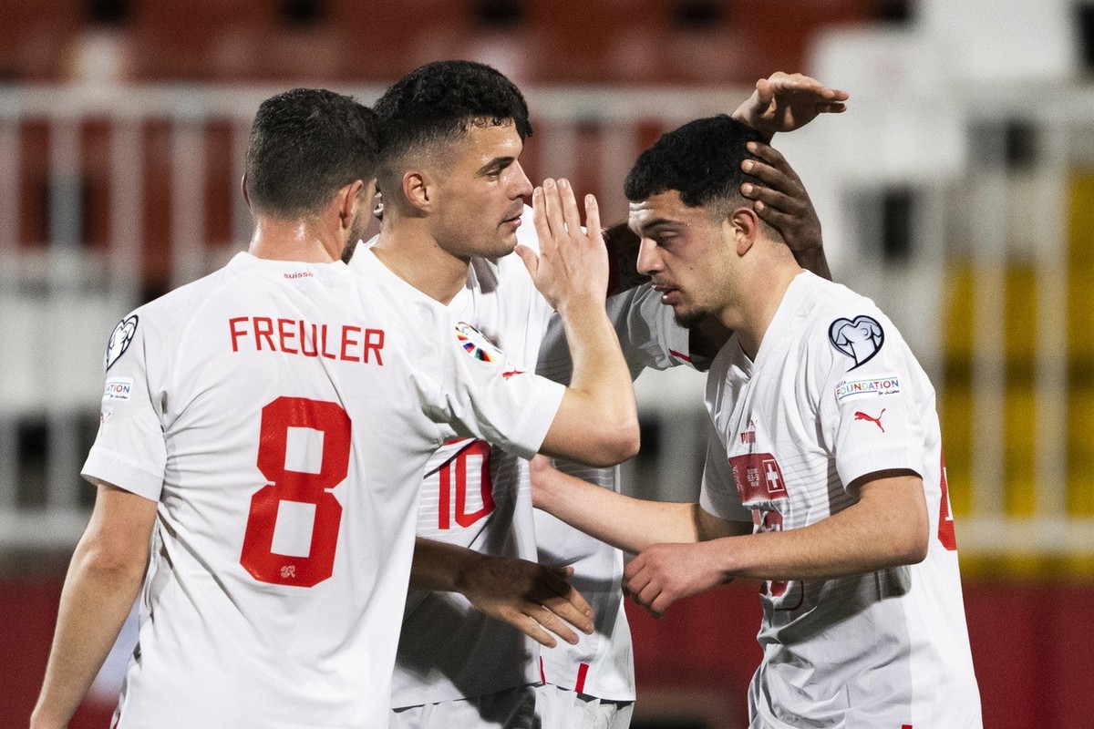 Switzerland's midfielder Remo Freuler, Switzerland's midfielder Granit Xhaka and Switzerland's forward Zeki Amdouni, from left, celebrate after Amdouni scored 0-5 during the UEFA Euro 2 ...