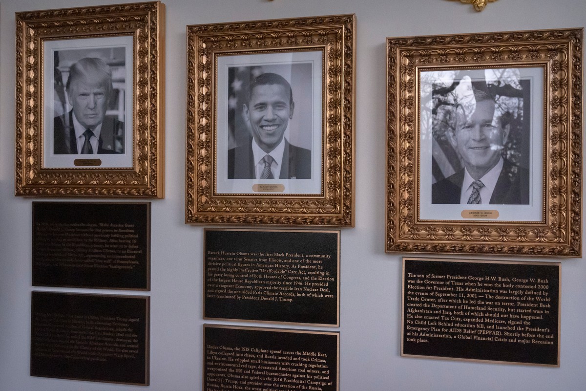 Portraits of President Donald Trump and former Presidents Barack Obama and George W. Bush with plaques of text below are seen on the Presidential Walk of Fame on the Colonnade of the White House, Wedn ...