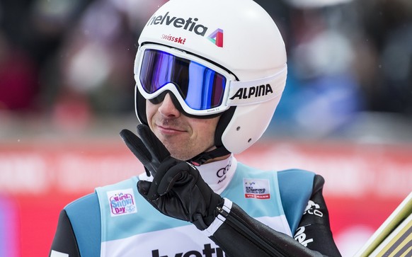 epa06395544 Simon Ammann of Switzerland reacts in the finish area during the Men&#039;s HS 140 competition at the FIS Ski Jumping World Cup in Engelberg, Switzerland, 17 December 2017. EPA/ALEXANDRA W ...