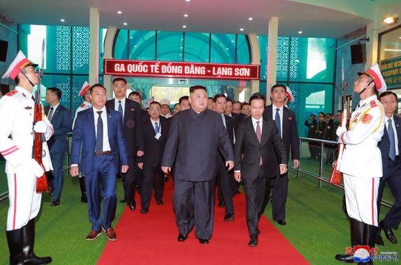 In this Tuesday, Feb. 26, 2019, photo provided by the North Korean government, North Korean leader Kim Jong Un, center, arrives at the Dong Dang railway station in Dong Dang, Vietnam, ahead of his second summit with U.S. President Donald Trump. The content of this image is as provided and cannot be independently verified. Korean language watermark on image as provided by source reads: "KCNA" which is the abbreviation for Korean Central News Agency. (Korean Central News Agency/Korea News Service via AP)