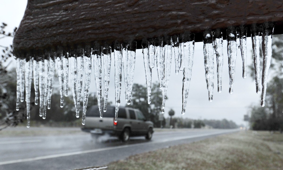 Icicles hang from the "Welcome to Hilliard sign" in Hilliard, Fla., Wednesday, Jan. 3, 2018. A brutal winter storm scattered a wintry mix of snow, sleet and freezing rain from normally balmy ...