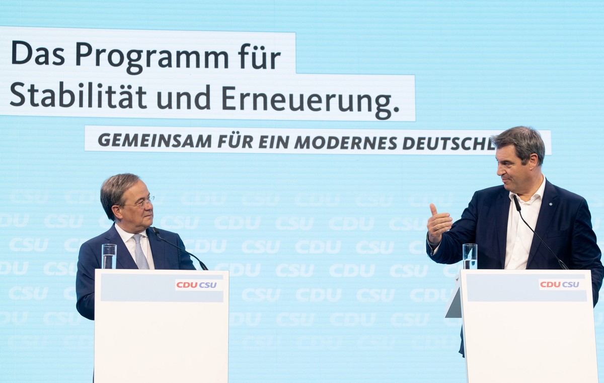 epa09290420 Christian Democratic Union (CDU) party chairman Armin Laschet (L) and Leader of the Christian Social Union (CSU) and Bavaria's State Premier Markus Soeder attend a press conference af ...