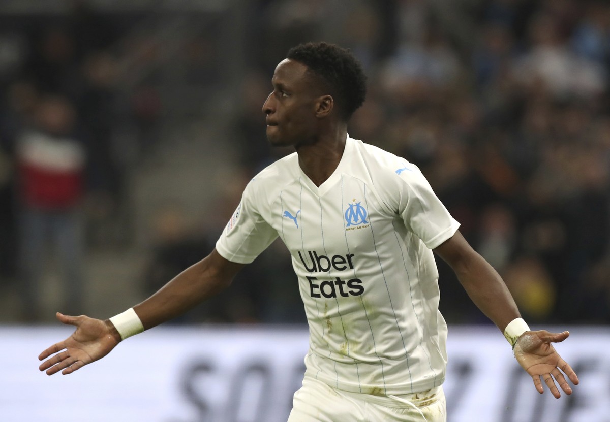 Marseille's Bouna Sarr celebrates after scoring his side's opening goal during the French League One soccer match between Marseille and Brest at the Velodrome stadium in Marseille, southern  ...