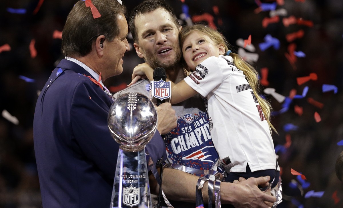 New England Patriots' Tom Brady holds his daughter, Vivian, after the NFL Super Bowl 53 football game against the Los Angeles Rams, Sunday, Feb. 3, 2019, in Atlanta. The Patriots won 13-3. (AP Ph ...
