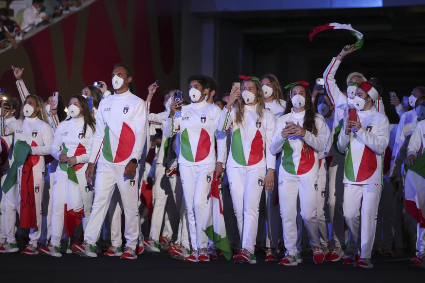 Team Italy arrives during the opening ceremony in the Olympic Stadium at the 2020 Summer Olympics, Friday, July 23, 2021, in Tokyo, Japan. (Hannah McKay/Pool Photo via AP)