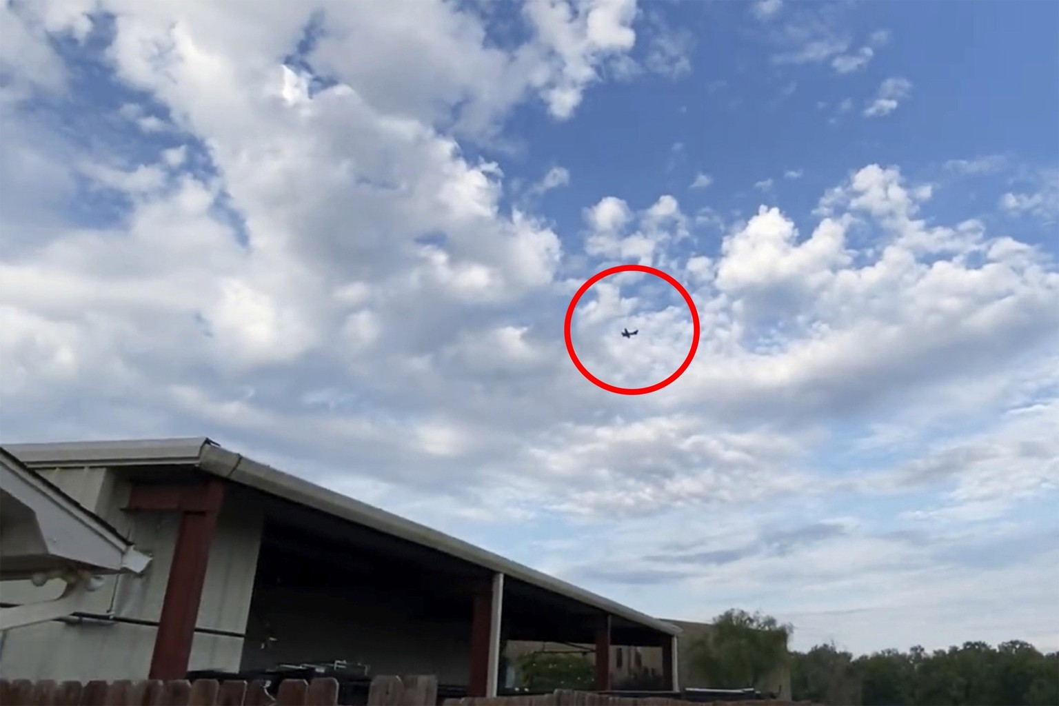 A small airplane circles over Tupelo, Miss., on Saturday, Sept. 3, 2022. Police say the pilot of the small airplane is threatening to crash the aircraft into a Walmart store. The Tupelo Police Departm ...