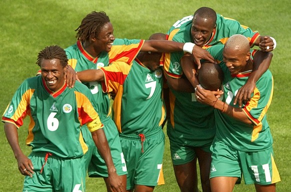 FILE - In this June 11, 2002 file photo Senegal&#039;s players celebrate after scoring their third goal in the first half of their 2002 World Cup Group A soccer match against Uruguay at the Suwon Worl ...