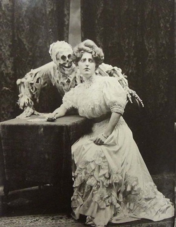 https://imgur.com/gallery/nEQyZrA A photo from the ballad of “Death and the Lady," Vaudeville in England in 1906.