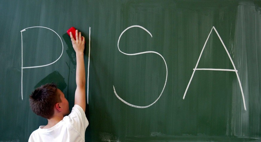 A boy is wiping a blackboard on which the acronym PISA (programme for international student assessment) is written, Magdeburg, July 8, 2003. In former and recent evaluations of the assessment Germany  ...