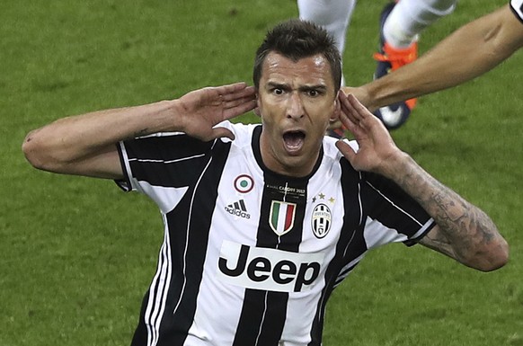 Juventus&#039; Mario Mandzukic celebrates scoring his side&#039;s first goal during the Champions League Final soccer match between Juventus and Real Madrid at the Millennium Stadium in Cardiff, Wales ...