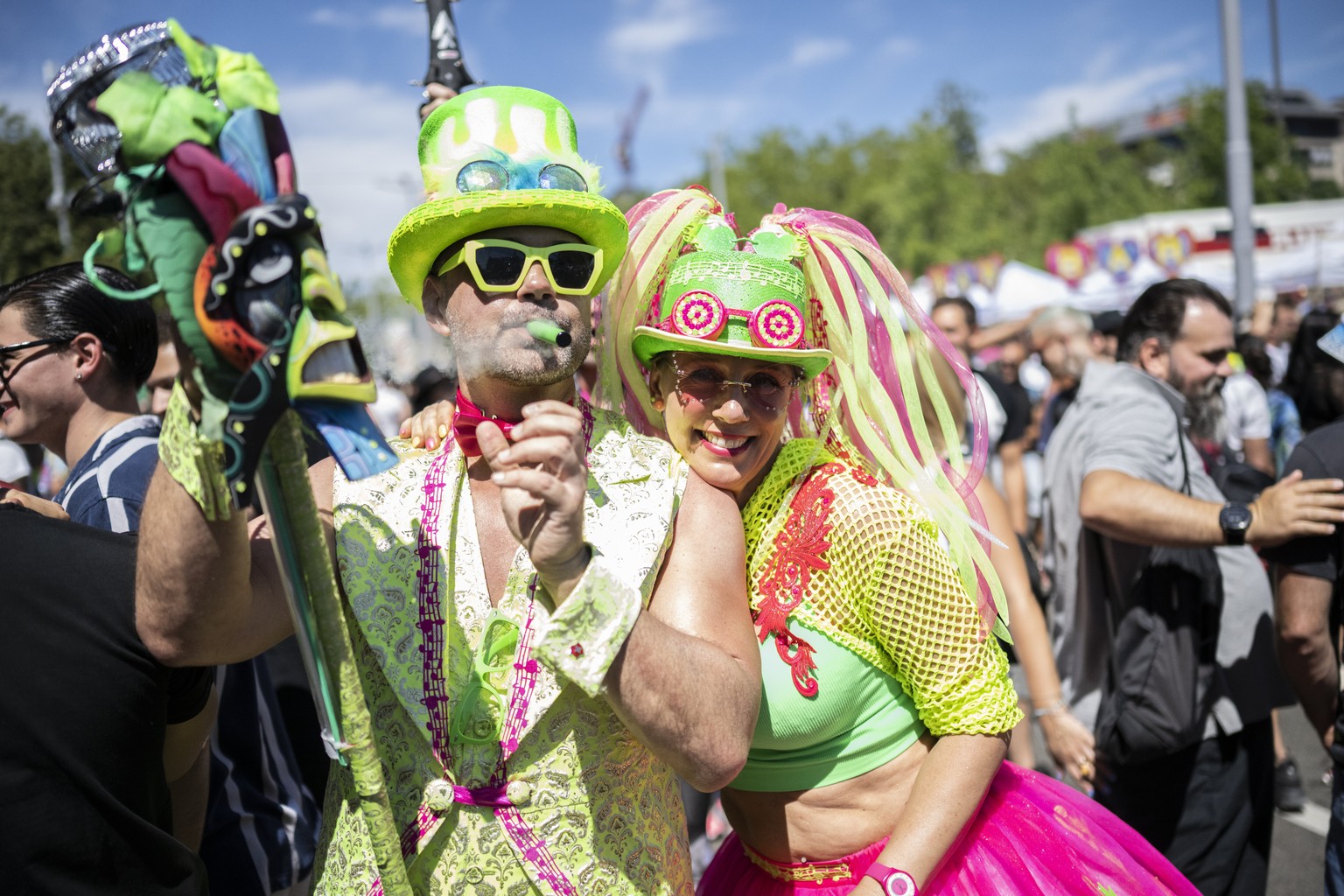 epa10118485 Costumed participants pose as thousands of people attend the 29th Street Parade in the city center of Zurich, Switzerland, 13 August 2022. The annual dance music event Street Parade runs t ...