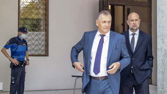 epa08668236 Former Fifa general secretary Jerome Valcke, center, and his lawyer Patrick Hunziker arrive at the Federal Criminal Court in Bellinzona, Switzerland, 14 September 2020. PSG president Al-Kh ...