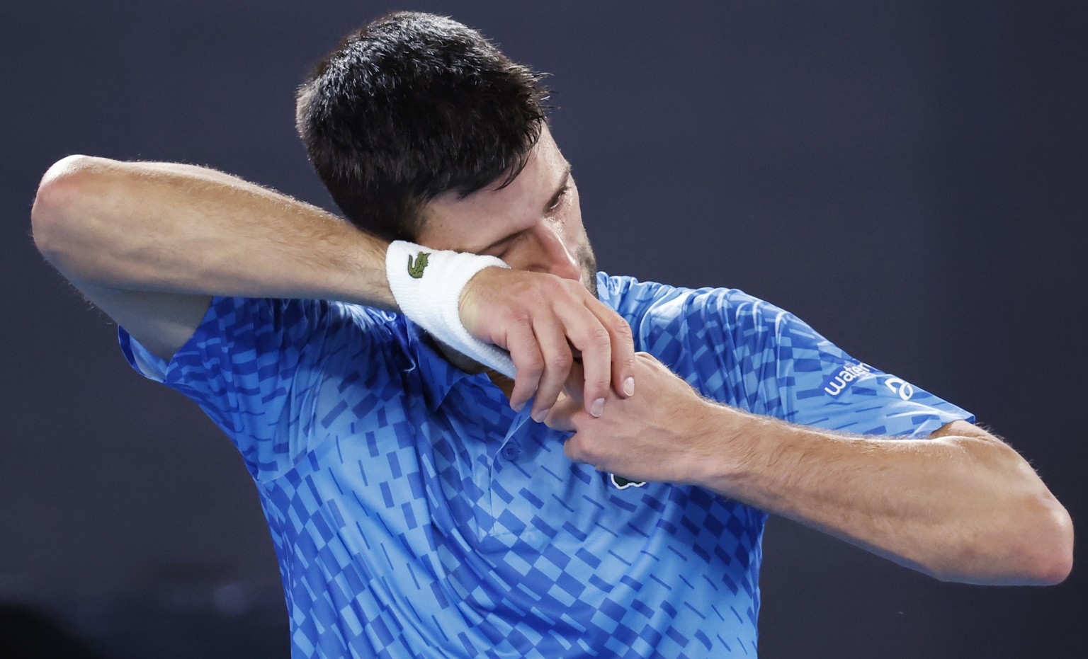 Novak Djokovic of Serbia wipes away tears after defeating Stefanos Tsitsipas of Greece in the men&#039;s singles final at the Australian Open tennis championships in Melbourne, Australia, Sunday, Jan. ...