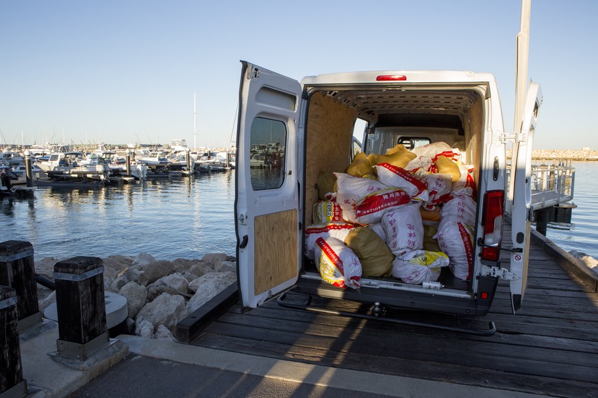 epa06402489 A handout photo made available by the Asutralian Federal Police shows a police operation that uncovered 1.2 tonnes of methamphetamine, seized at the port in Geraldton, Western Australia, A ...