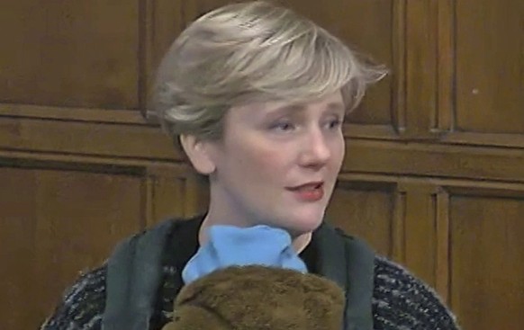 In this grab take from House of Commons TV, Labour MP Stella Creasy carries her son, Pip, during a Westminster Hall debate in Parliment, London, Tuesday, Nov. 23, 2021. Some British politicians are de ...