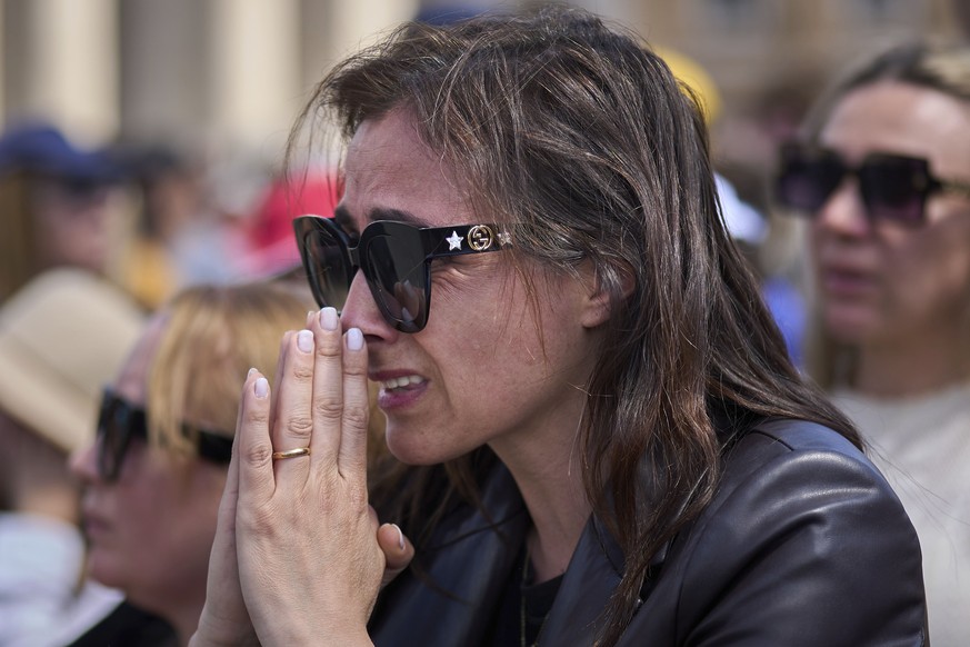 A faithful reacts during the funeral of Pope Francis in St. Peter&#039;s Square at the Vatican, Saturday, April 26, 2025. (AP Photo/Emilio Morenatti)
APTOPIX Vatican Pope