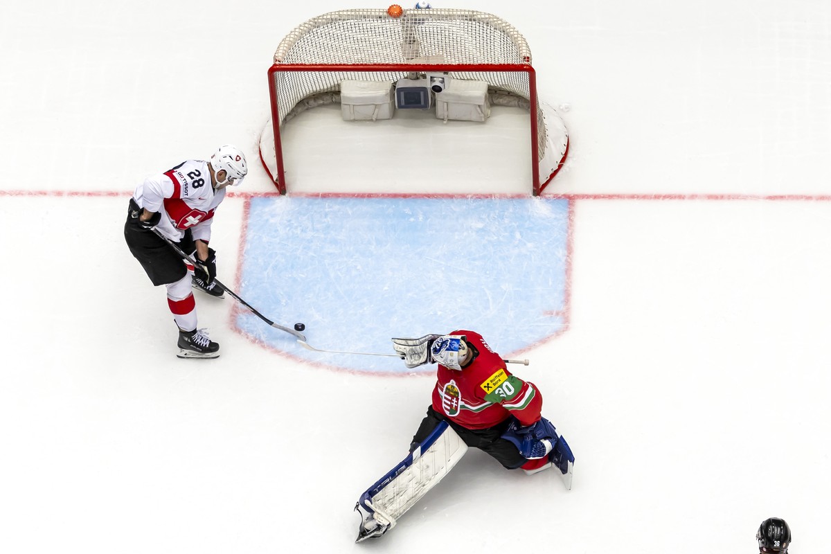 Switzerland's forward Timo Meier #28 scores the 0:4 against Hungary's goaltender Adam Vay, during the IIHF 2025 World Championship preliminary round group B game between Hungary and Switzerl ...