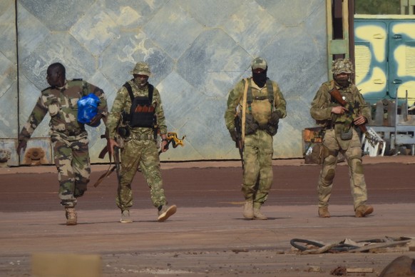 This undated photograph handed out by French military shows three Russian mercenaries, right, in northern Mali. Russia has engaged in under-the-radar military operations in at least half a dozen count ...