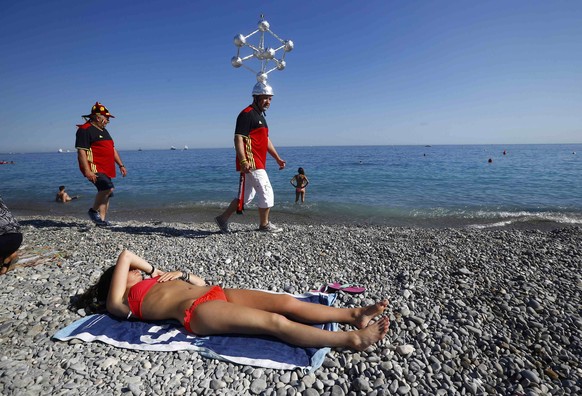 Football Soccer - Euro 2016 - Nice, France, 22/6/16 - A Belgium fan wears a model of the Atomium on his head in Nice, France. REUTERS/Wolfgang Rattay TPX IMAGES OF THE DAY