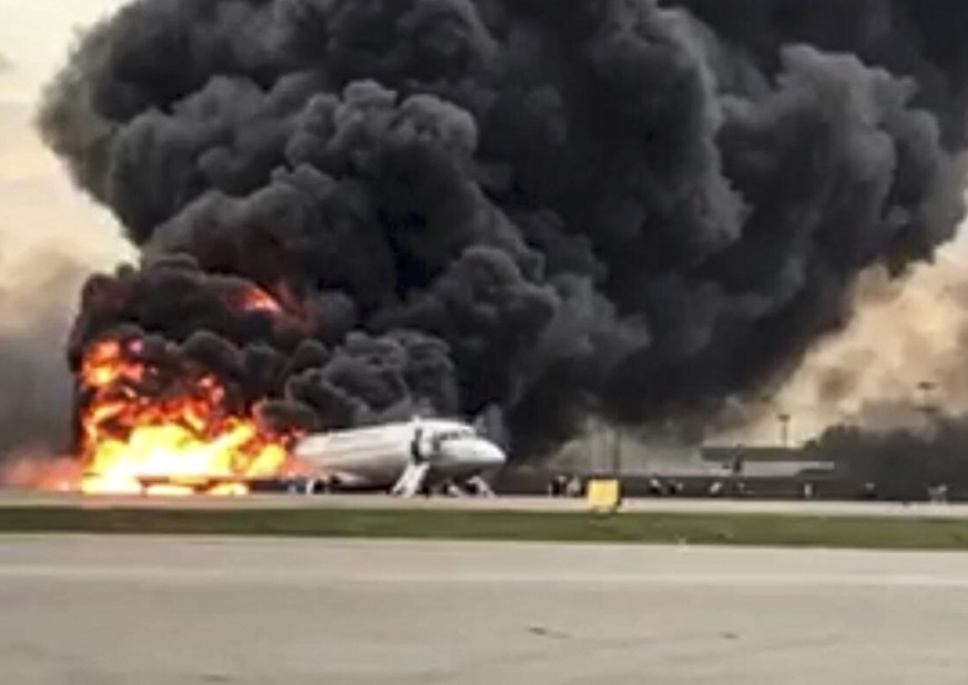 This image taken from a video distributed by Russian Investigative Committee on Sunday, May 5, 2019, shows the Sukhoi SSJ100 aircraft of Aeroflot Airlines on fire, at Sheremetyevo airport, outside Mos ...