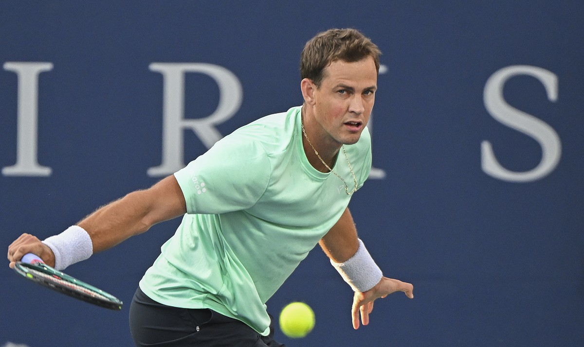 Vasek Pospisil of Canada plays a shot to Sebastian Korda of the United States during their first round match at the National Bank Open tennis tournament in Montreal, Wednesday, August 7, 2024. (Graham ...