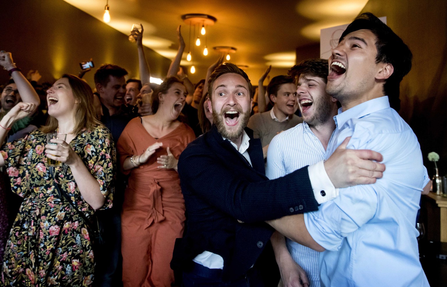 epa07595433 Members of the Labour Party (PvdA) of Frans Timmermans celebrate after the exit polls of the European Parliament elections The Hague, The Netherlands, 23 May 2019. The European Parliament  ...