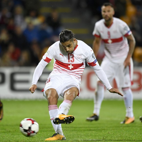 epa06181896 Swiss defender Ricardo Rodriguez scores the 3-0 lead from the penalty spot during the 2018 Fifa World Cup group B qualifying soccer match Latvia against Switzerland at Skonto Stadium, in R ...