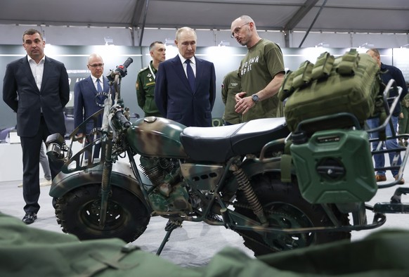 epa12220667 Russian President Vladimir Putin (2-R) tours an exhibition showcasing the results of the All-Russian People&#039;s Front&#039;s efforts over the past three years, held under the motto of & ...