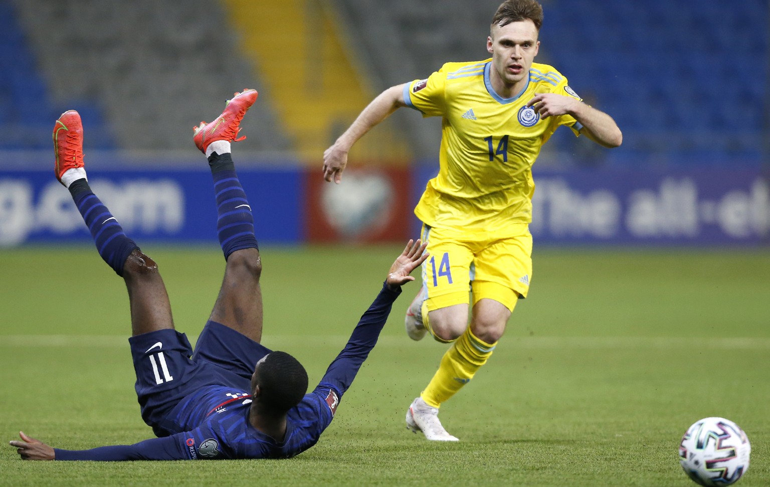 Kazakhstan&#039;s Vladislav Vassiljev, right, and France&#039;s Ousmane Dembele challenge for the ball during the World Cup 2022 group D qualifying soccer match between Kazakhstan and France at the As ...