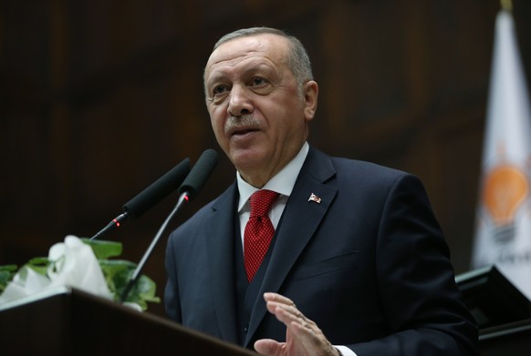 epa08127106 A handout photo made available by the Turkish President Press office shows Turkish President Recep Tayyip Erdogan addressing members of the ruling Justice and Development Party (AKP) at th ...