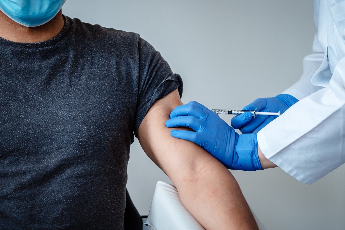 epa08814067 An undated handout picture made available by the German pharmaceutical company Biontec shows the dosing of BNT162b2, the mRNA-based vaccine candidate against COVID-19, during the clinical  ...