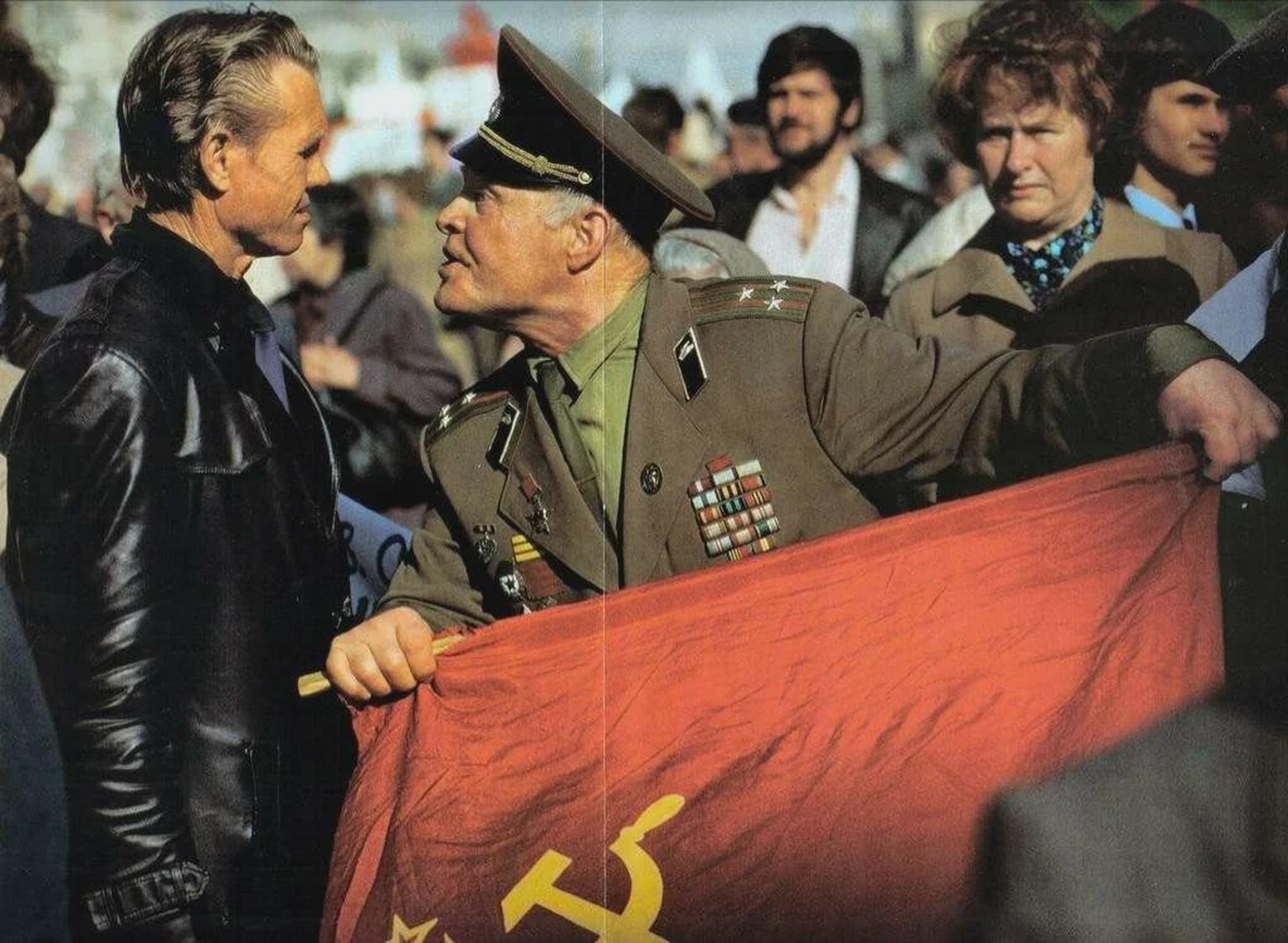 A flag-waving veteran of the Red Army confronting an anti-communist protester in Moscow, circa 1990.