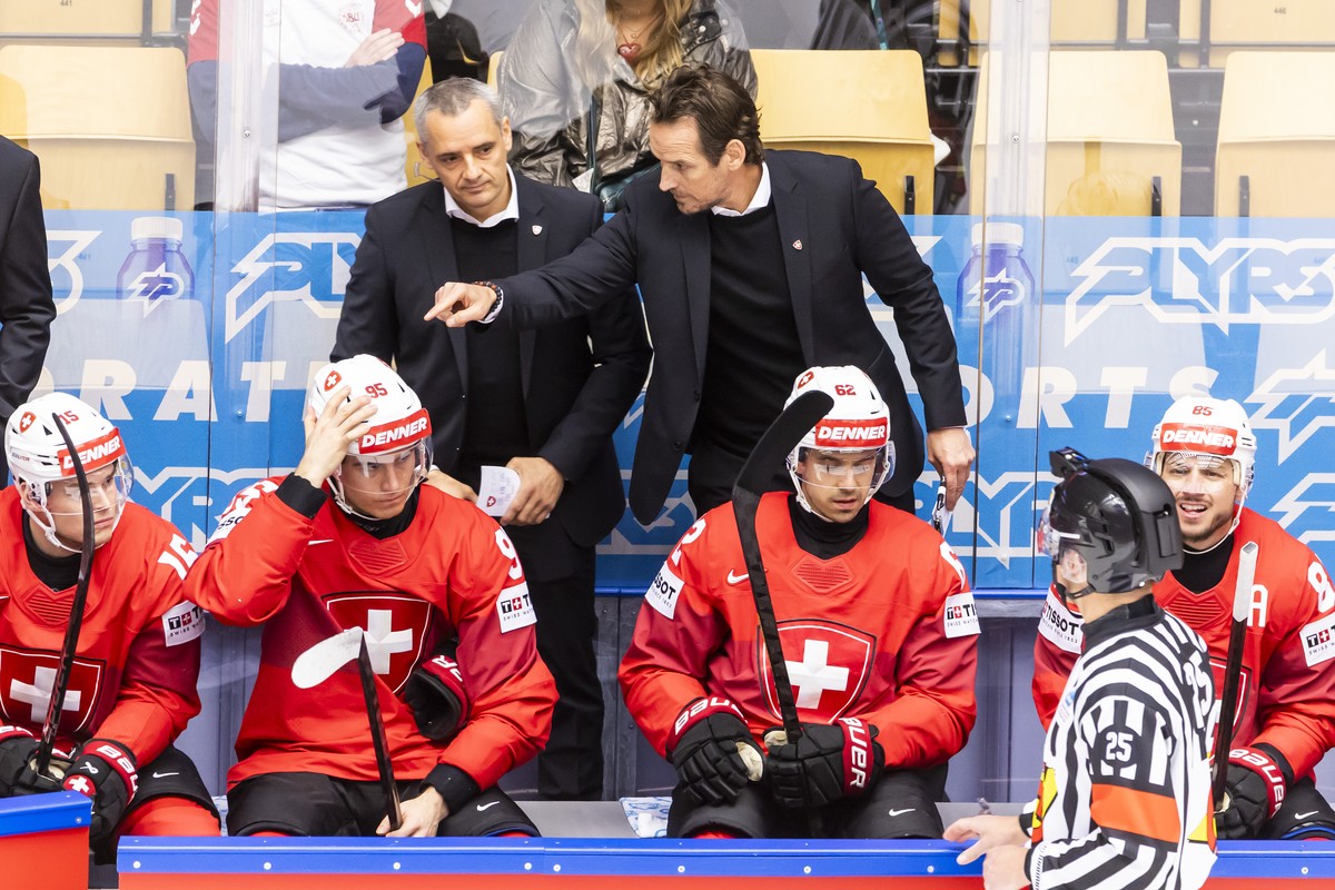 Patrick Fischer, right, head coach of Switzerland national ice hockey team, gestures next to Jan Cadieux Jan, left, assistant coach of Switzerland national ice hockey team, during the IIHF 2025 World  ...