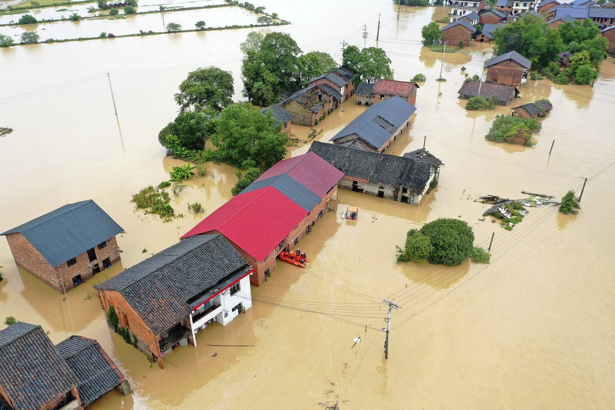 epa11502881 An aerial drone photo shows the flooded Jingtang Village, Zixing, Hunan, China, 28 July 2024. The residual winds from Typhoon Gaemi continue to bring heavy rains to many places in Hunan Pr ...