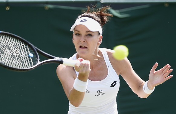 epa06070028 Agnieszka Radwanska of Poland in action against Christina McHale of the USA during their second round match for the Wimbledon Championships at the All England Lawn Tennis Club, in London,  ...