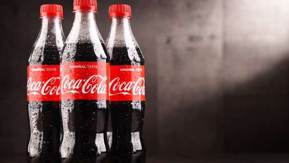 POZNAN, POLAND - MAR 1, 2018: Plastic bottles of Coca-Cola, a carbonated soft drink manufactured by The Coca-Cola Company headquartered in Atlanta, Georgia, USA
