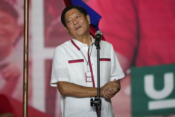 FILE - Presidential candidate, Ferdinand Marcos Jr., the son of the late dictator, reacts to the crowd at their last campaign rally known as &quot;Miting De Avance&quot; on Saturday, May 7, 2022 in Pa ...