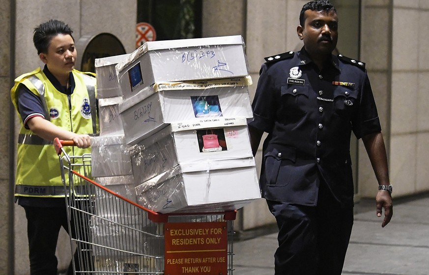 epa06745949 Boxes are seized by Royal Malaysian Police at the Pavilion Residents, Kuala Lumpur, Malaysia, 18 May 2018. Police have confiscated over 70 bags containing cash and valuables, and more than ...