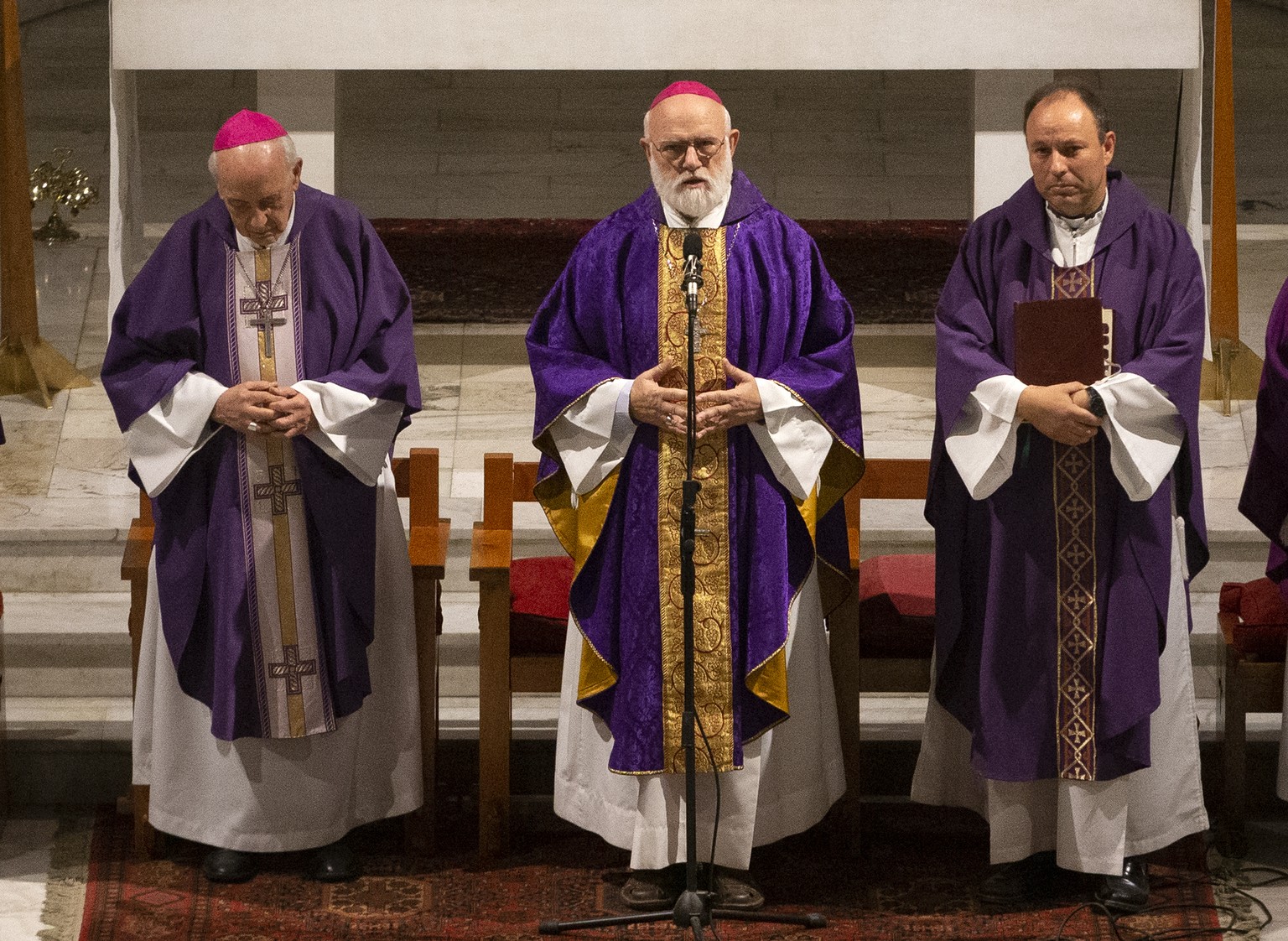 In this March 28, 2019 photo, Bishop Carlos Eugenio Irarrázabal, right, takes part in a Mass with acting archbishop of Santiago, Monsignor Celestino Aos, center, at El Bosque Parish in Santiago, Chile ...