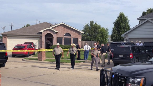 Denton County Sheriff Deputies work the scene of a shooting in Ponder, Texas where multiple people died Wednesday, May 16, according to Capt. Orlando Hinojosa, a spokesman for the Denton County Sherif ...
