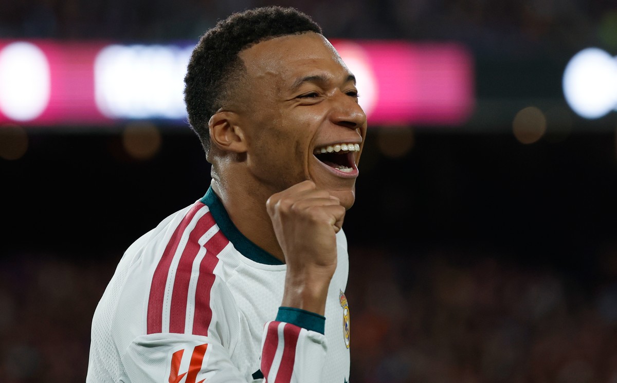 Real Madrid's Kylian Mbappe celebrates after scoring his side's opening goal during a Spanish La Liga soccer match between FC Barcelona and Real Madrid in Barcelona, Spain, Sunday, Oct. 25,  ...